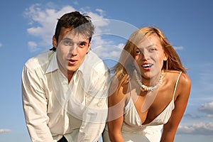 Astonish couple on skies background