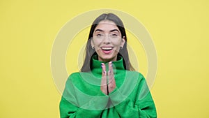 Astonished Caucasian Woman Clapping Hands on Yellow Background