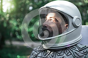 Astonished male cosmonaut glancing up