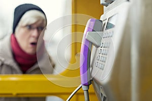 Astonished Senior at a phone booth