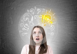 Astonished woman in pink, questions, light bulb