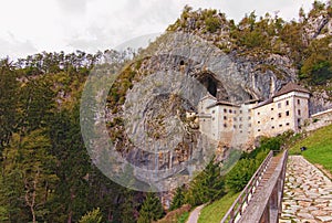 Astonishing landscape of medieval Predjama castle Slovene. Predjamski grad. Castle at the cave mouth