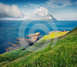 Astonishing morning view of Koltur Island. Fresh green summer scene of outskirts of Velbastadur village, Faroe Islands, Denmark, E