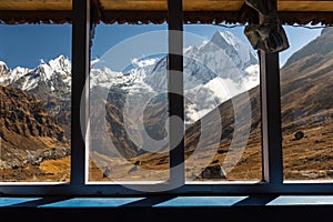 Astonishing views through the window glass of Fish Tail Machapuchare in the Annapurna range, Himalayas