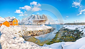 Astonishing winter view of Sakrisoy village and snowy mountaines on background