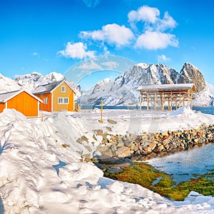 Astonishing winter view of Sakrisoy village and snowy mountaines on background