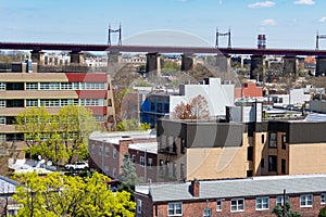 Astoria Queens New York Neighborhood Skyline with Residential Buildings and the Hell Gate Railroad Bridge in the background