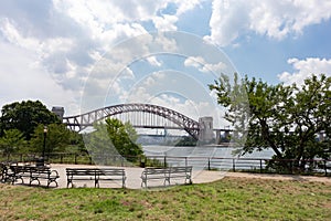 Astoria Queens Riverfront Park along the East River in New York City during Summer with the Hell Gate Bridge