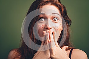 Astounded woman disbelief expression hands mouth photo