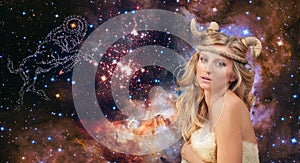Astrology. Aries Zodiac Sign. Woman on night sky background