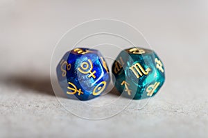 Astrology Dice with zodiac symbol of Scorpio and its ruling planet Pluto