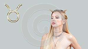 Astrology and horoscope, Taurus Zodiac Sign. Beautiful with long hair and horns photo