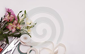 Astromeria Flowers and garden tools on White background with Copy Space photo