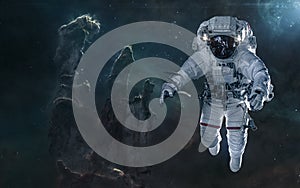 Astronaut on background of the Pillars of Creation. Deep space landscape. Science fiction photo