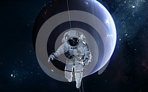 Astronaut on background of Uranus. Solar system. Science fiction