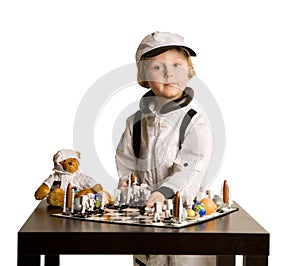 Astronaut boy playing chess