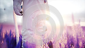 Astronaut with butterflies in lavender field. concept of future. broadcast. 3d rendering.