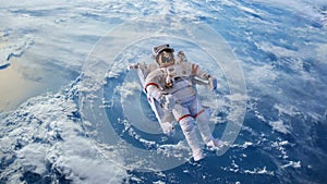 Astronaut or Cosmonaut animation flying outer space over the planet Earth. Some Element provided by NASA