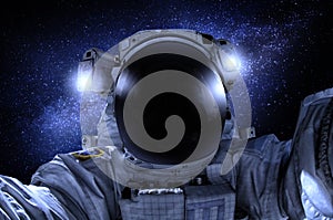 Astronaut or cosmonaut in the universe closeup