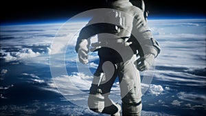 Astronaut floating above the earth elements of this image