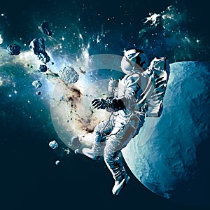 Astronaut floating in space. New worlds and unexplored galaxies. Asteroids and planet