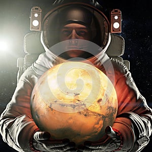 Astronaut holding the red planet of Mars. Exploration and journey to Mars concept. 3d rendering .Elements of this image furnished