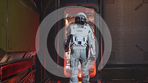 The astronaut leave the control room and walk along the corridor of the interstellar spacecraft. The image is for