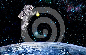 Astronaut lighting in galaxy.mission in outer space photo