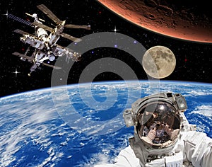 Astronaut, mars and moon. The elements of this image furnished by NASA