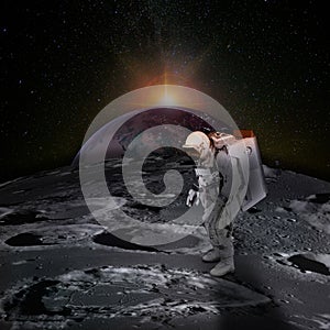 Astronaut on moon surface with space background.