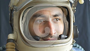 Astronaut Opens Helmet Window