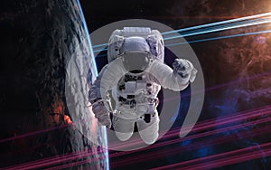 Astronaut in orbit of deep space planet