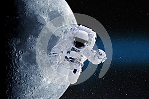 Astronaut in outer space on a background of moon. Elements of this image furnished by NASA.