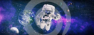 Astronaut in outer space.Cosmic art, science fiction wallpaper. Beauty of deep space. Elements of this image furnished by NASA