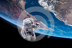 Astronaut in outer space over of the Earth