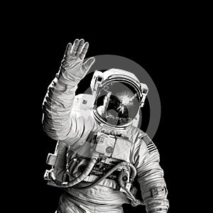 Astronaut in outer space waving his hand to the camera.