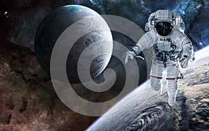 Astronaut, planets of deep space against background of nebulae. Science fiction