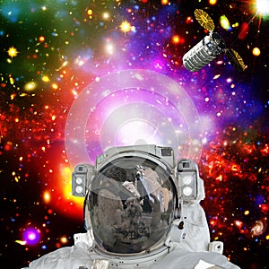 Astronaut posing against galaxies and stars. Outer space. The elements of this image furnished by NASA