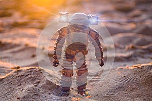 Astronaut on a sandy planet, sunset, space exploration