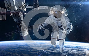 Astronaut, space station in deep space. Beautiful cosmic landscape. Science fiction