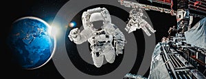 Astronaut spaceman do spacewalk while working for space station