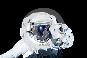 Astronaut in a spacesuit isolated on a black background. Elements of this image were furnished by NASA.