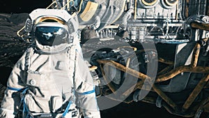 An astronaut stands beside his lunar rover at the space moon base. View of the lunar surface and lunar colony. 3D