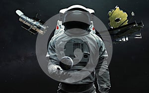 Astronaut and two telescopes James Webb and Hubble. JWST launch art. Elements of image provided by Nasa