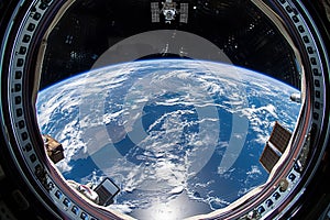 Astronaut using tablet in spacecraft orbiting earth serene beauty of weightlessness photo