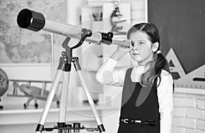 Astronaut Using Telescope. School astronomy lesson. Exploring space of new galaxies. School girl looking through