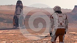 Astronaut Wearing Space Suit Walking On The Surface Of Mars. Exploring Mission To Mars. Futuristic Colonization and Space