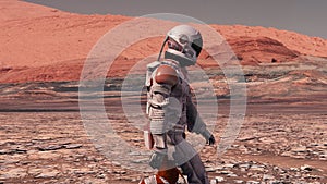 Astronaut wearing space suit walking on the surface of mars. Exploring mission to mars. Futuristic colonization and space explorat