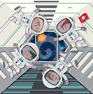 Astronauts floating in space ship