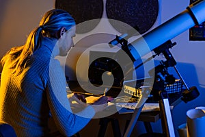 Astronomer man do science work using the telescope